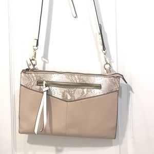 This pink and white Nanette Lepore bag is perfect for any day or occasion!